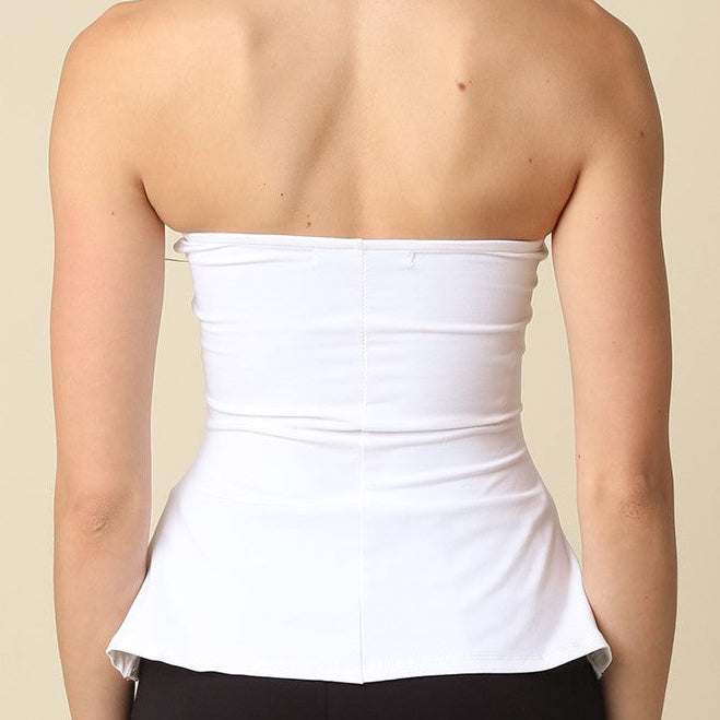 Olivaceous Mika strapless peplum tube top in black, featuring a fitted bodice with a flared peplum hem and smooth fabric.