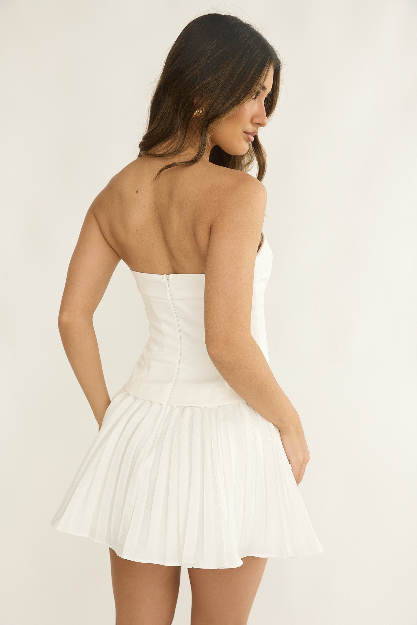 Yandy white strapless mini with pleated skirt