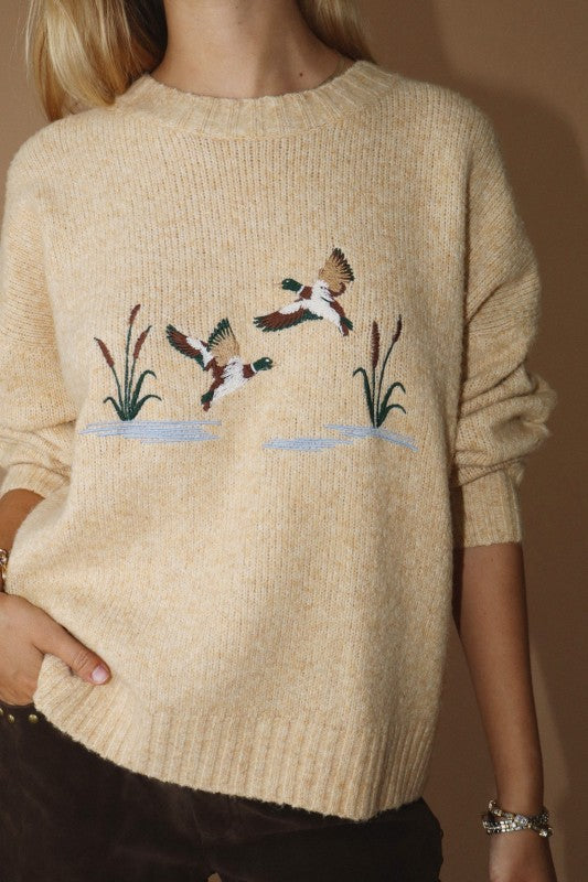 Sy tan butter duck graphic sweater