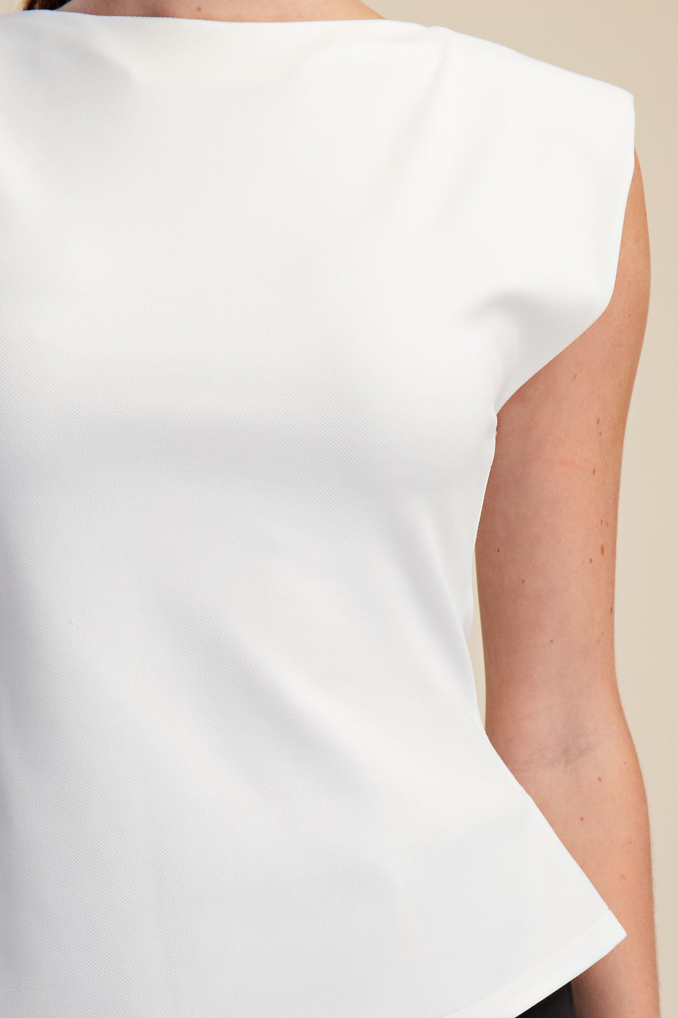 Millie White Sleeveless Padded Peplum Top