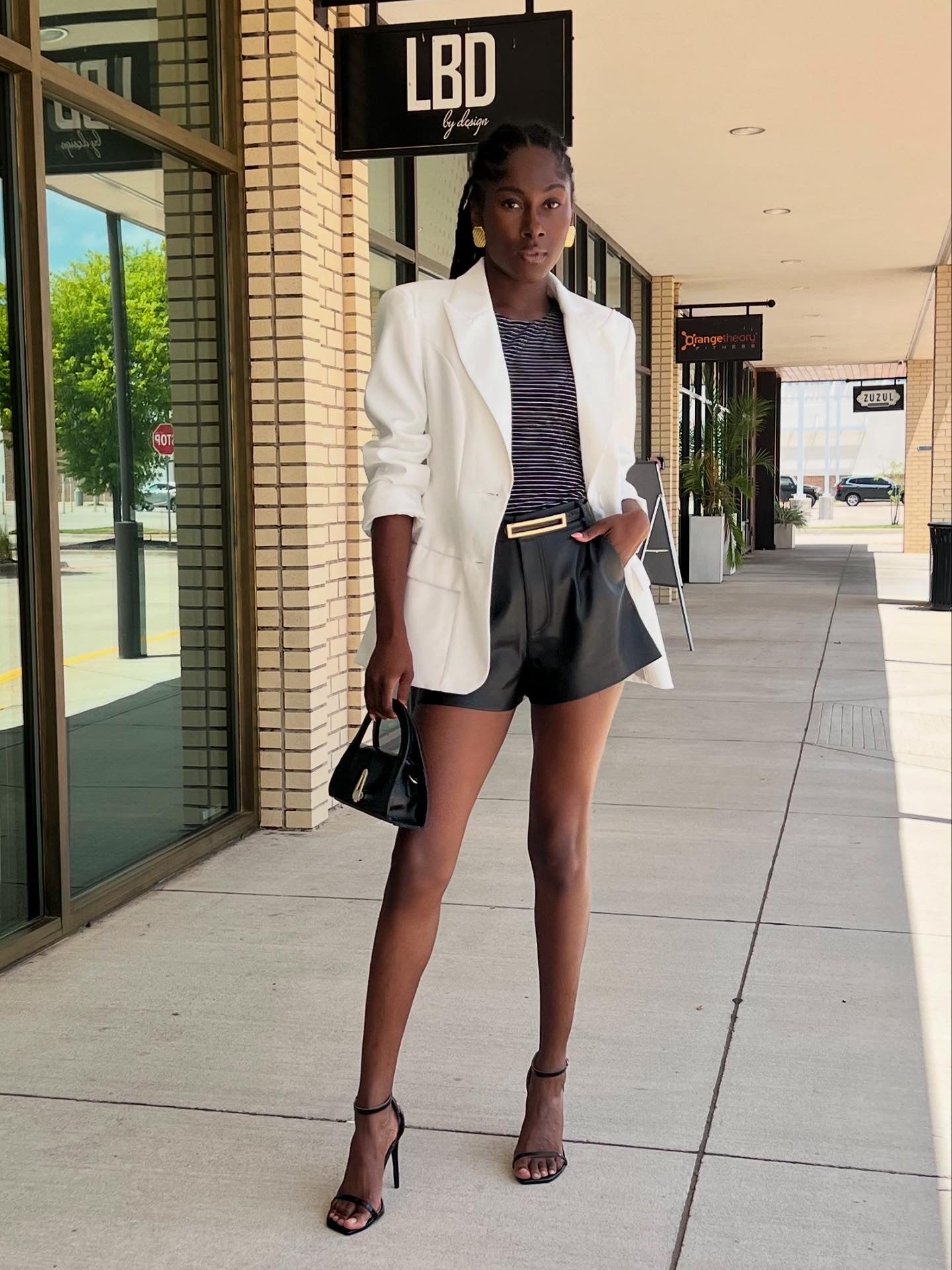 Elani black faux leather flat front short