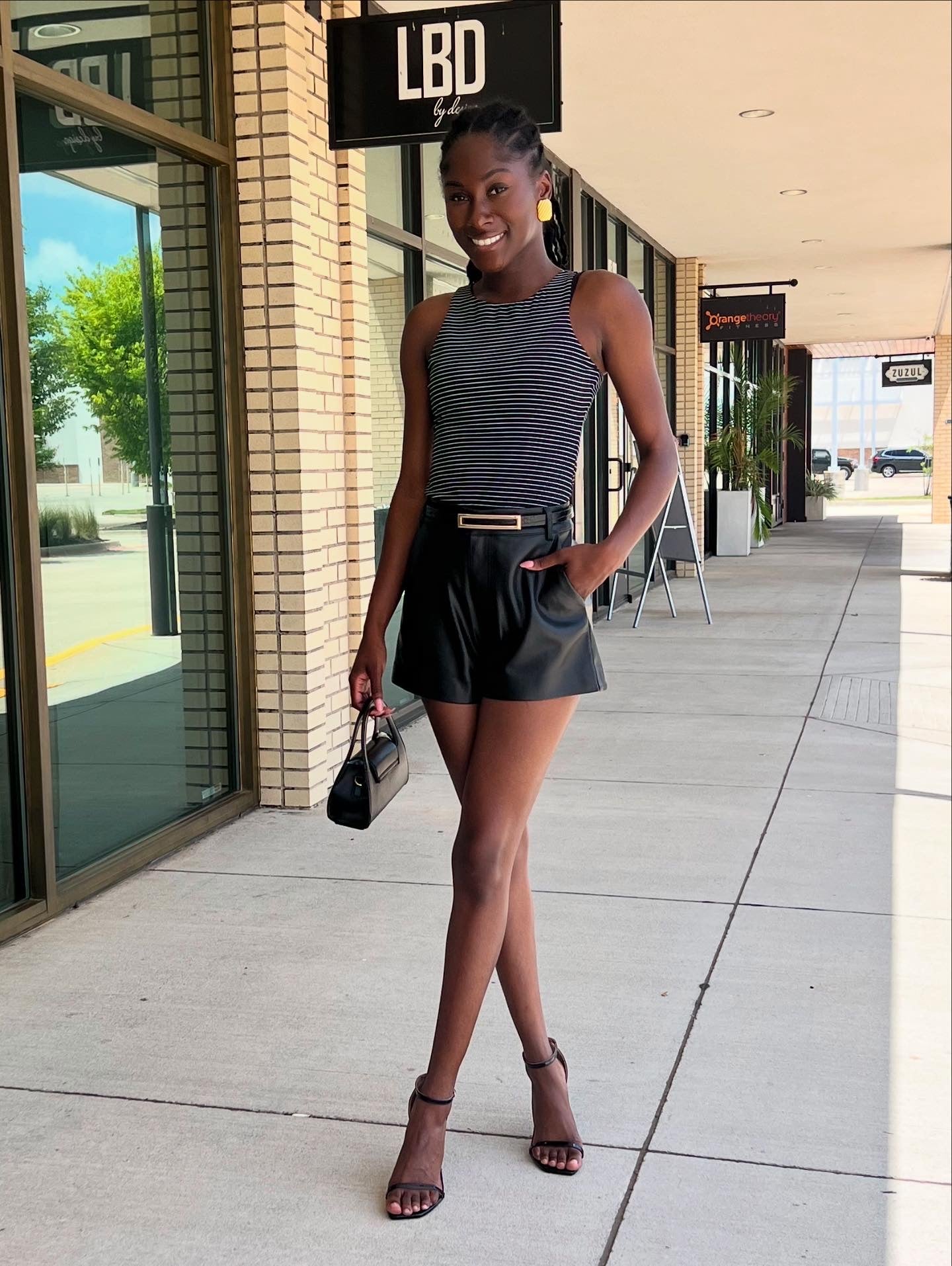Elani black faux leather flat front short