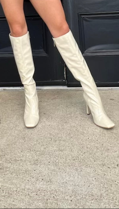 A Spladh Of Cream Patent Kner High Boots