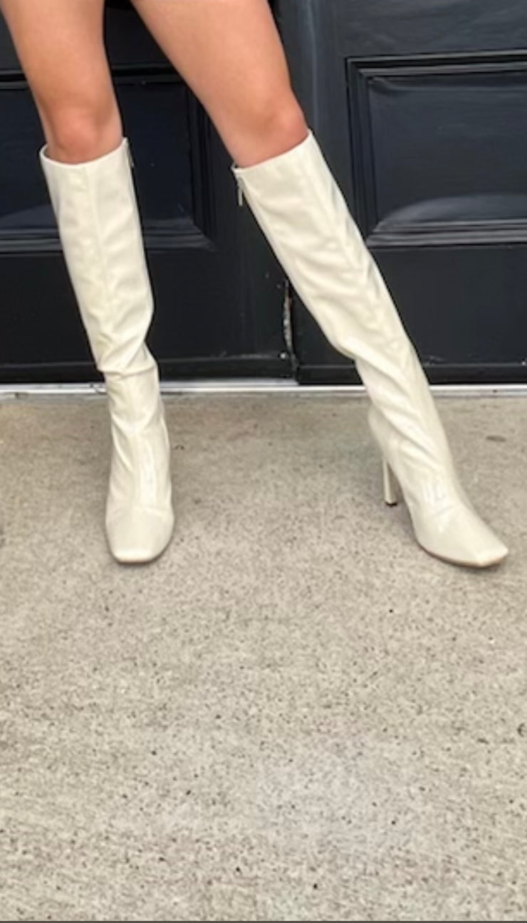 A Spladh Of Cream Patent Kner High Boots